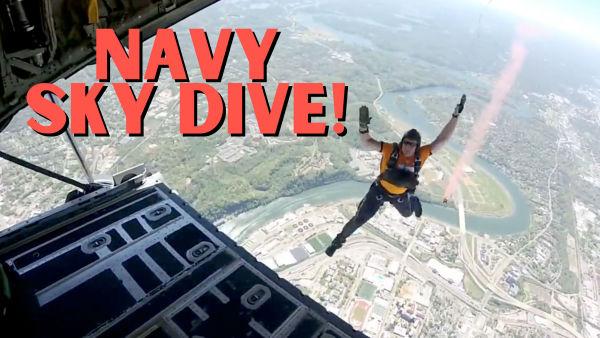 Let's watch the Navy sky dive into a stadium! 